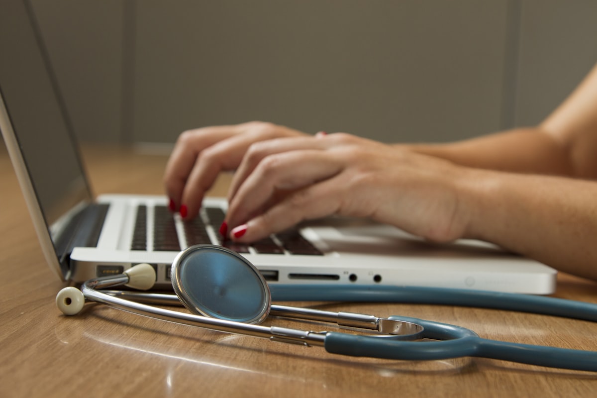 Clinician reviewing advanced medical AI data dashboards